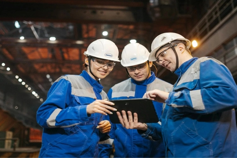 Enginers working viewing drawings